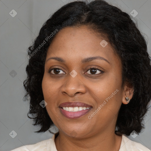 Joyful black young-adult female with medium  brown hair and brown eyes