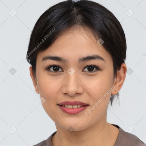 Joyful asian young-adult female with short  black hair and brown eyes