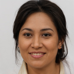 Joyful white adult female with medium  brown hair and brown eyes