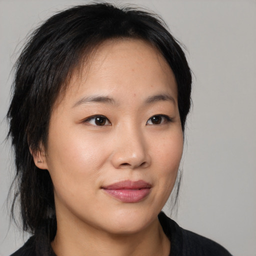 Neutral asian young-adult female with medium  brown hair and brown eyes