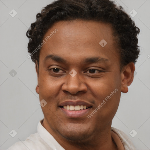 Joyful latino young-adult male with short  brown hair and brown eyes