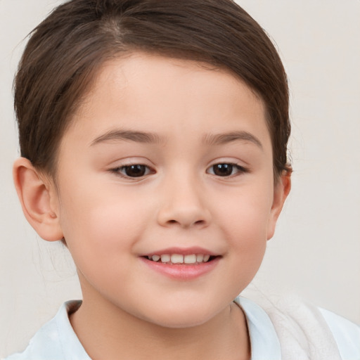 Joyful white child female with short  brown hair and brown eyes