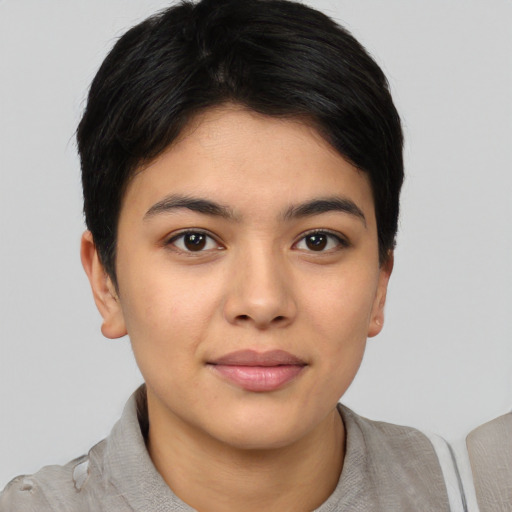 Joyful latino young-adult female with short  brown hair and brown eyes