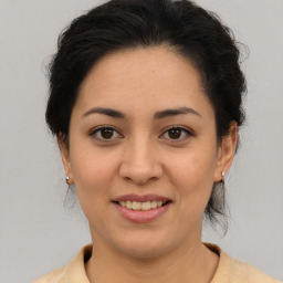 Joyful asian young-adult female with medium  brown hair and brown eyes