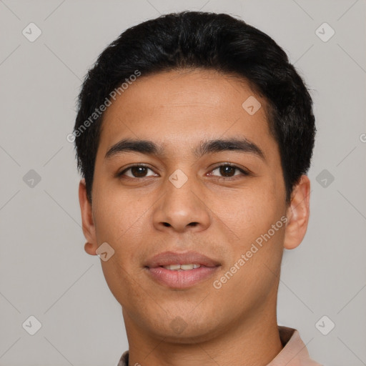 Joyful latino young-adult male with short  black hair and brown eyes