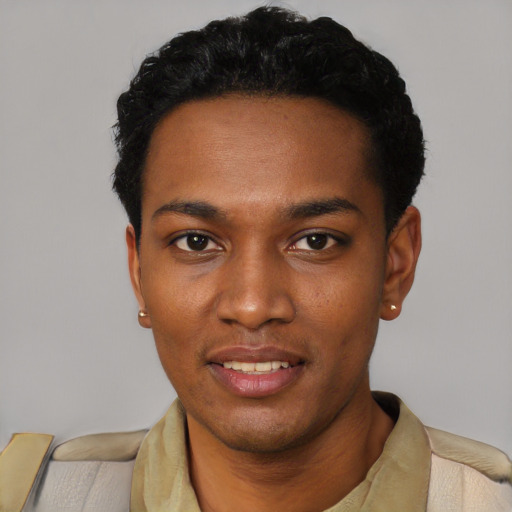 Joyful black young-adult male with short  black hair and brown eyes