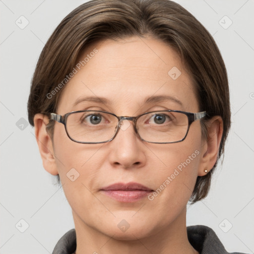 Joyful white adult female with short  brown hair and grey eyes