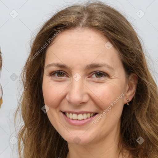 Joyful white adult female with long  brown hair and brown eyes