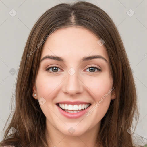 Joyful white young-adult female with long  brown hair and green eyes