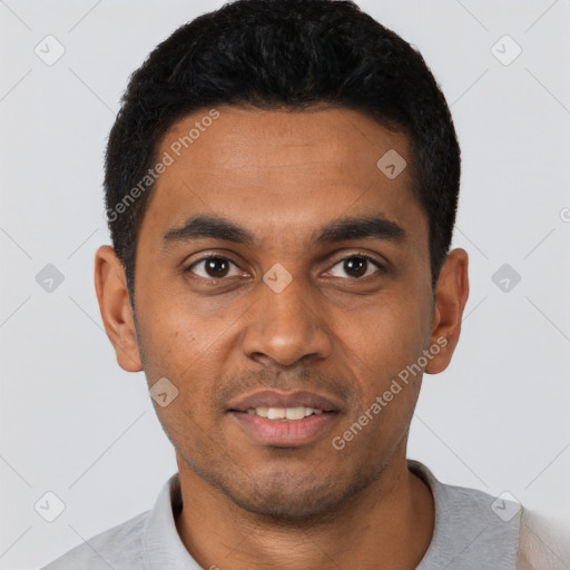Joyful black young-adult male with short  black hair and brown eyes
