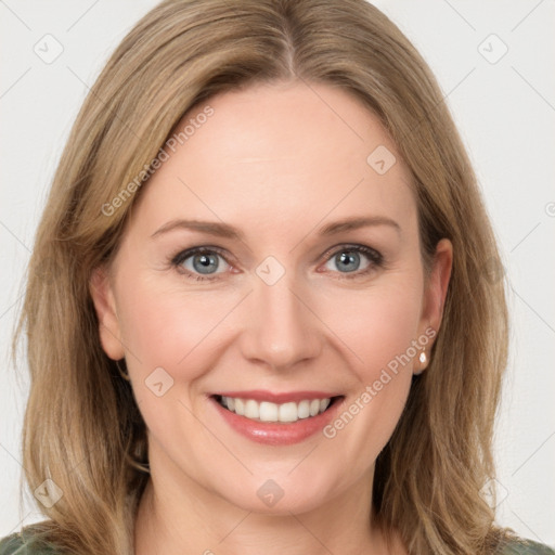 Joyful white young-adult female with long  brown hair and green eyes