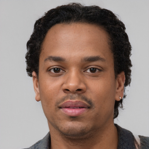 Neutral black young-adult male with short  black hair and brown eyes
