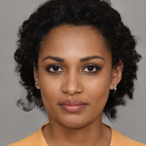 Neutral black young-adult female with short  black hair and brown eyes