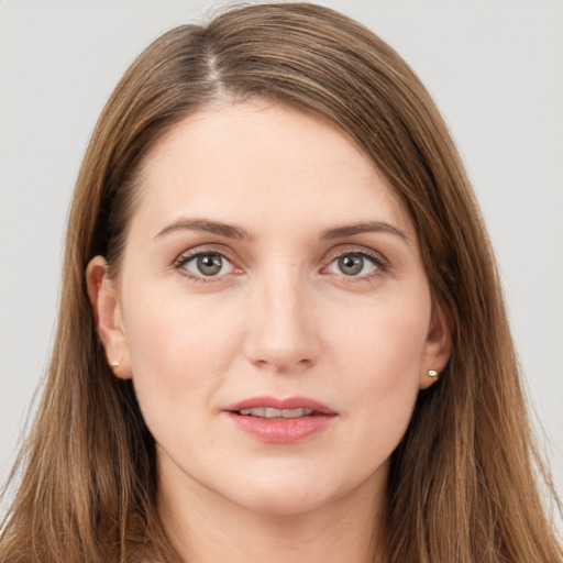 Joyful white young-adult female with long  brown hair and grey eyes