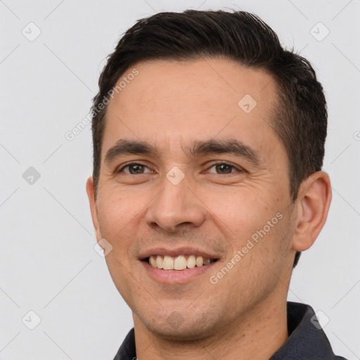 Joyful white young-adult male with short  brown hair and brown eyes