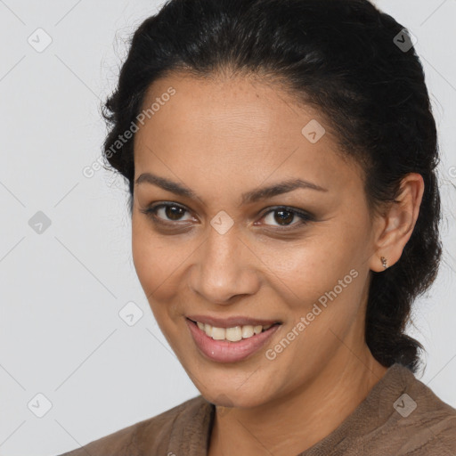 Joyful latino young-adult female with medium  brown hair and brown eyes