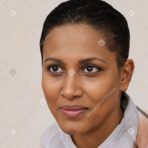 Joyful black young-adult female with short  brown hair and brown eyes