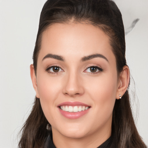 Joyful white young-adult female with long  brown hair and brown eyes