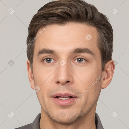 Joyful white young-adult male with short  brown hair and brown eyes