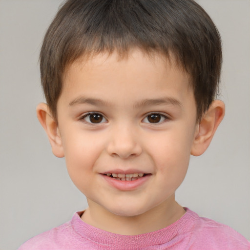 Joyful white child male with short  brown hair and brown eyes