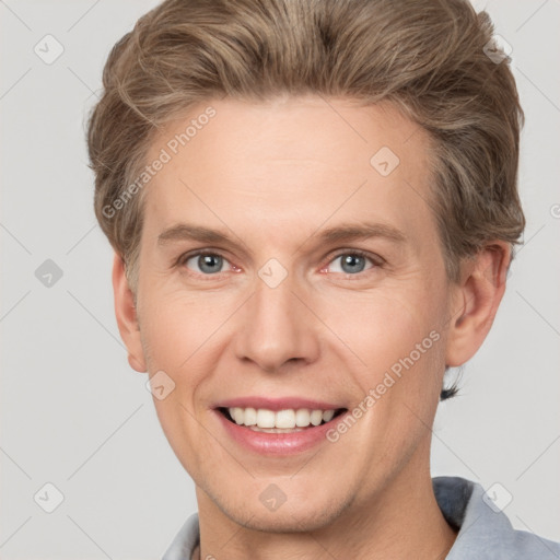 Joyful white adult male with short  brown hair and grey eyes