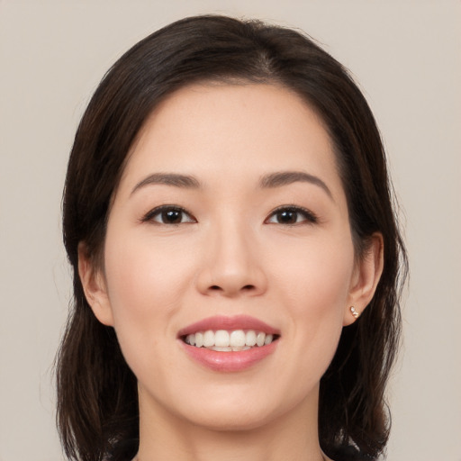 Joyful white young-adult female with medium  brown hair and brown eyes