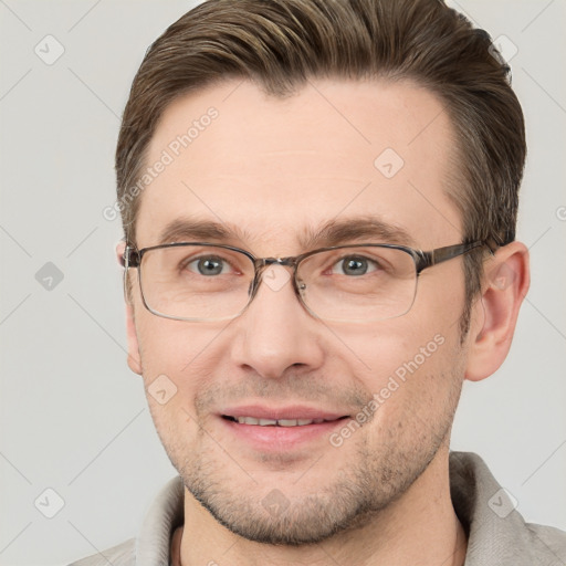 Joyful white adult male with short  brown hair and grey eyes