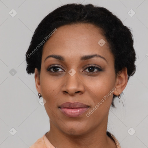 Joyful black young-adult female with medium  black hair and brown eyes