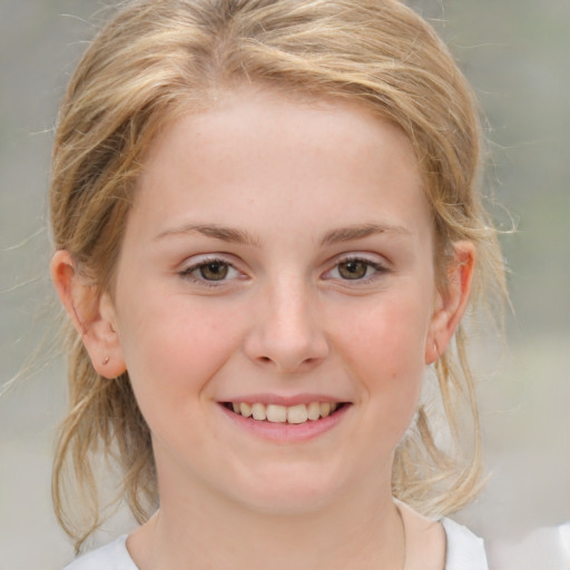 Joyful white child female with medium  brown hair and grey eyes