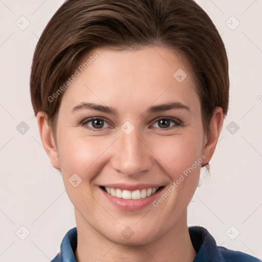 Joyful white young-adult female with short  brown hair and grey eyes