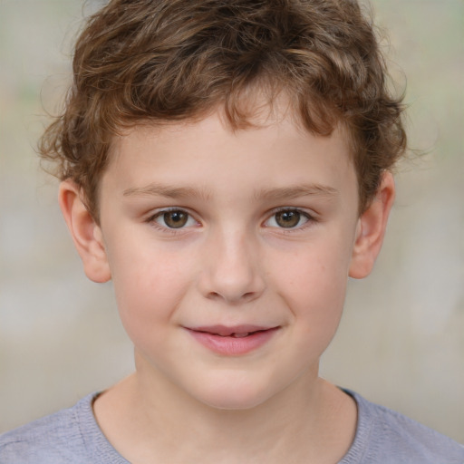 Joyful white child male with short  brown hair and brown eyes