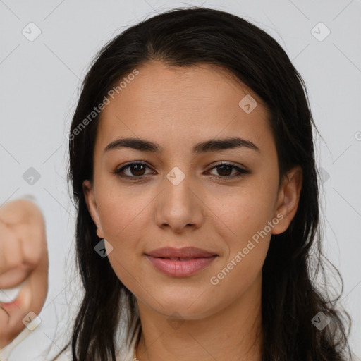 Joyful latino young-adult female with long  brown hair and brown eyes