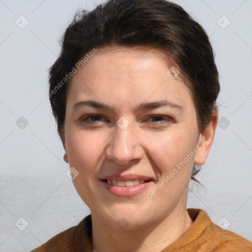 Joyful white adult female with short  brown hair and brown eyes