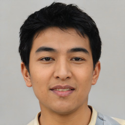 Joyful asian young-adult male with short  black hair and brown eyes