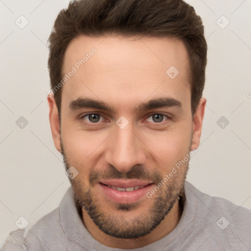 Joyful white young-adult male with short  brown hair and brown eyes