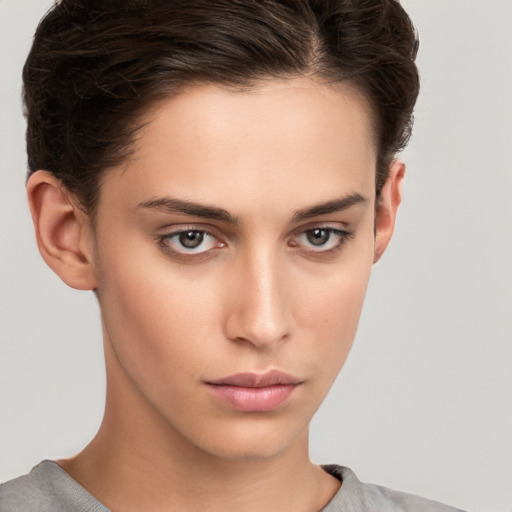 Neutral white young-adult female with short  brown hair and brown eyes