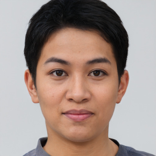 Joyful asian young-adult female with short  black hair and brown eyes