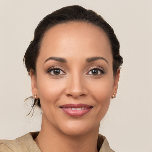 Joyful latino young-adult female with short  brown hair and brown eyes