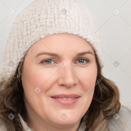 Joyful white young-adult female with medium  brown hair and blue eyes