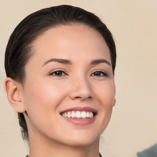 Joyful white young-adult female with medium  brown hair and brown eyes