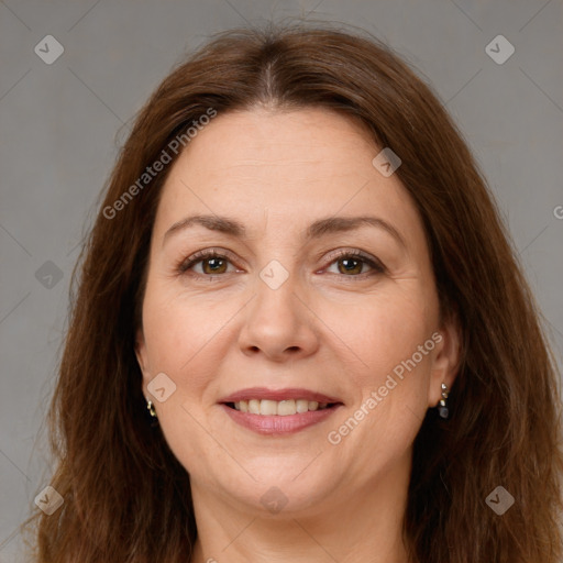 Joyful white adult female with long  brown hair and brown eyes