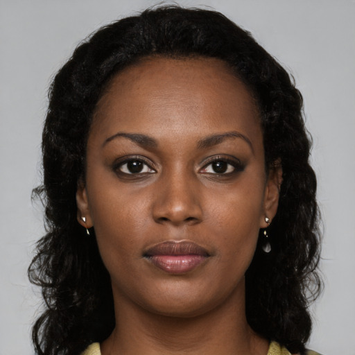 Neutral black young-adult female with long  black hair and brown eyes