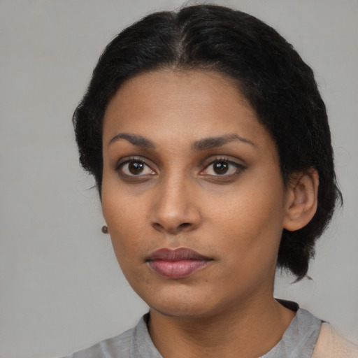 Neutral latino young-adult female with medium  black hair and brown eyes