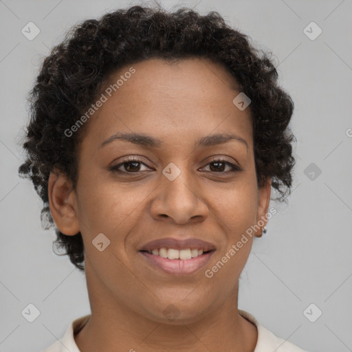 Joyful black young-adult female with short  brown hair and brown eyes