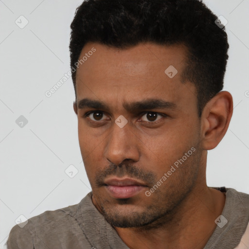 Neutral latino young-adult male with short  black hair and brown eyes