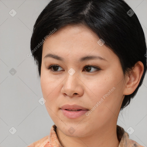Joyful asian adult female with medium  brown hair and brown eyes