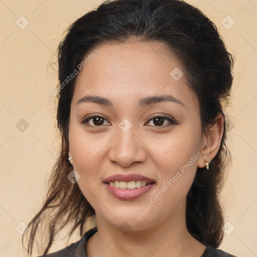 Joyful latino young-adult female with long  brown hair and brown eyes