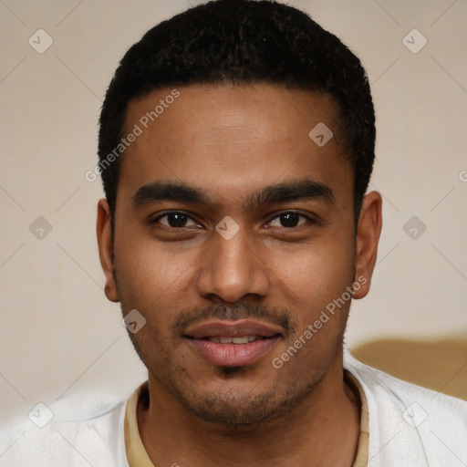 Joyful black young-adult male with short  black hair and brown eyes