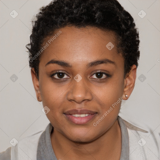 Joyful black young-adult female with short  black hair and brown eyes