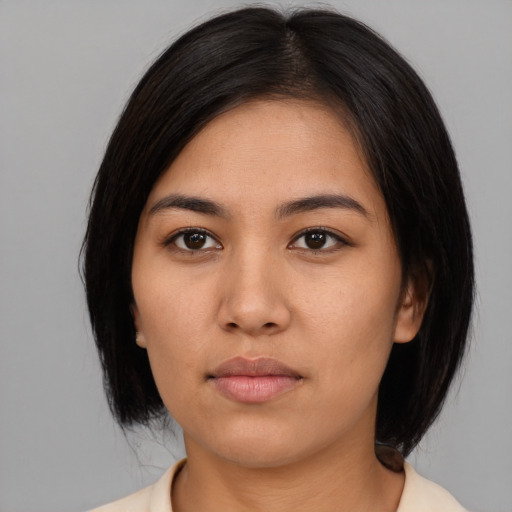 Neutral asian young-adult female with medium  black hair and brown eyes